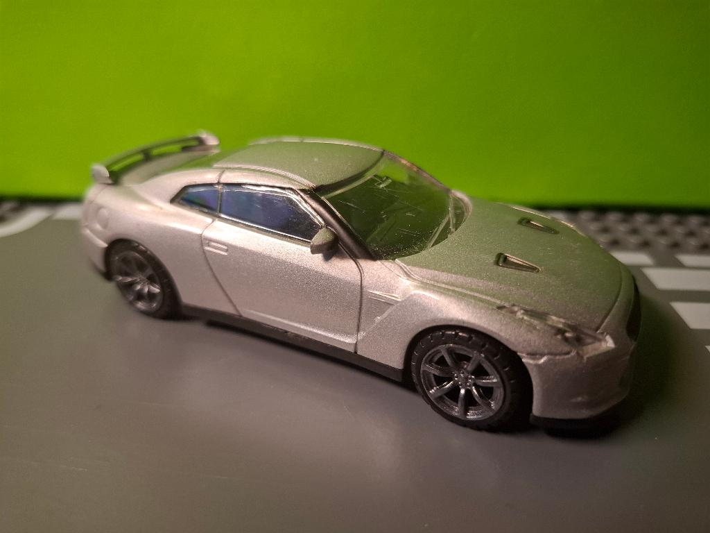 Rastar - 2009 Nissan GT-R [zilver] 1/43, Ophalen of Verzenden, Gebruikt, Auto, Overige merken