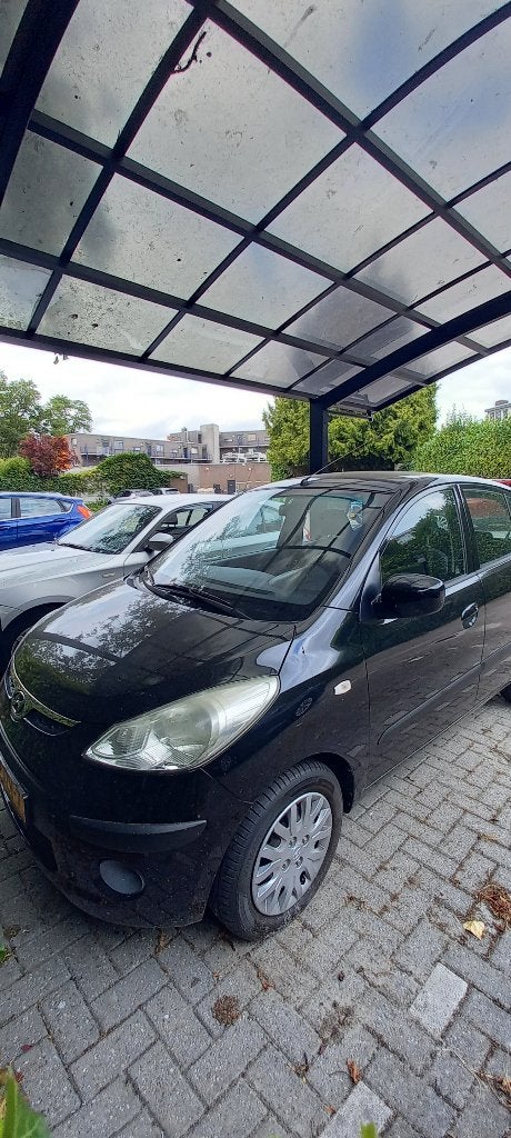 Hyundai i10 1.25 I 5DR AUT 2009 Zwart, Auto's, Hyundai, Stof, 31 €/maand, 4 cilinders, Zwart