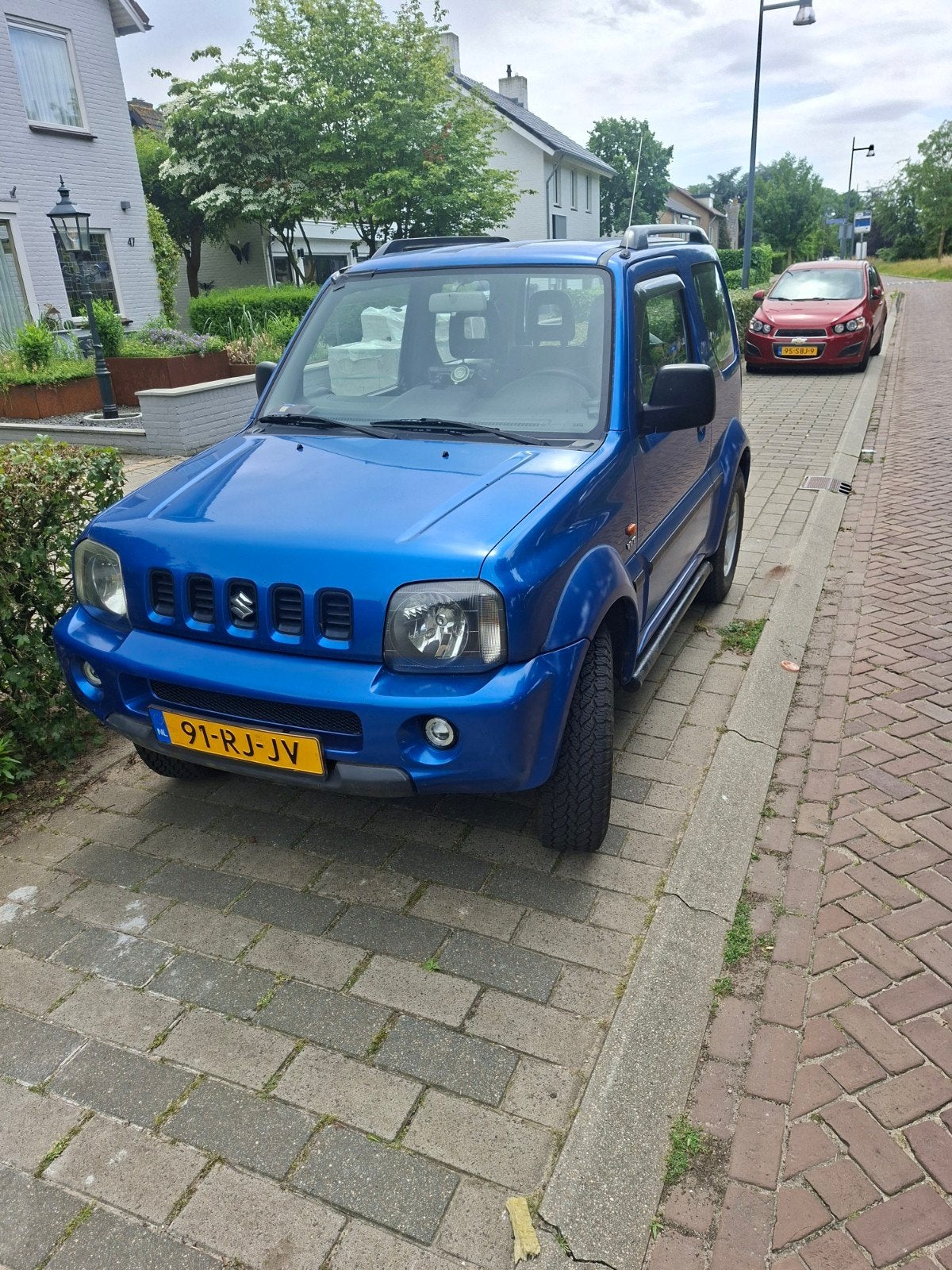 Suzuki Jimny 1.3 VVT 86pk 4WD 2005 Blauw airco, Auto's, Suzuki, 40 €/maand, Particulier, SUV of Terreinwagen, 750 kg