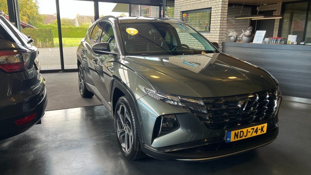 Hyundai TUCSON 1.6 T-GDI HEV Premium 230 Pk Automaat 1650 kg, Auto's, Gebruikt, Huisgarantie, 4 cilinders, Met garantie (alle)
