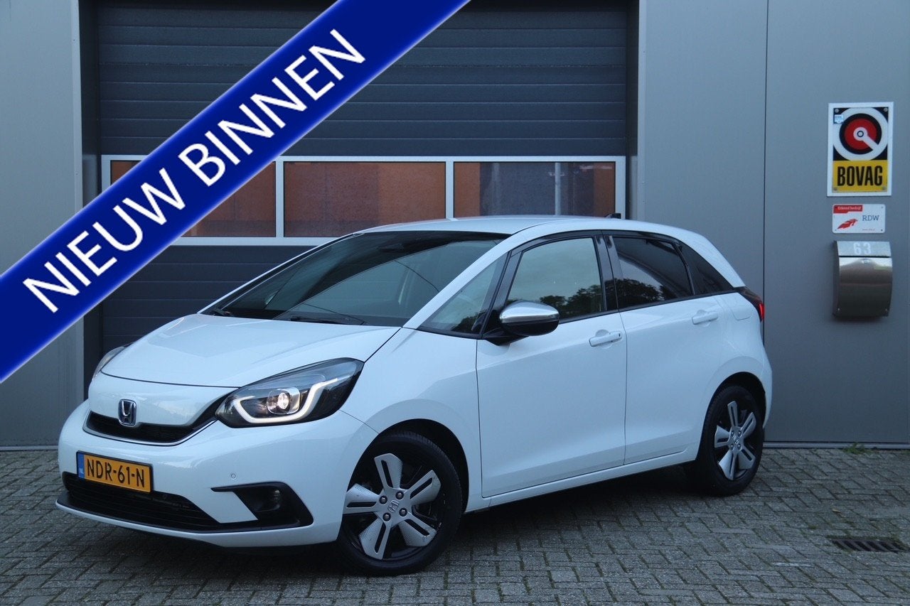 Honda Jazz 1.5 e:HEV Elegance Automaat, Stoel & Stuurverwarm, Auto's, Dealer onderhouden, Leder en Stof, Wit, Bedrijf