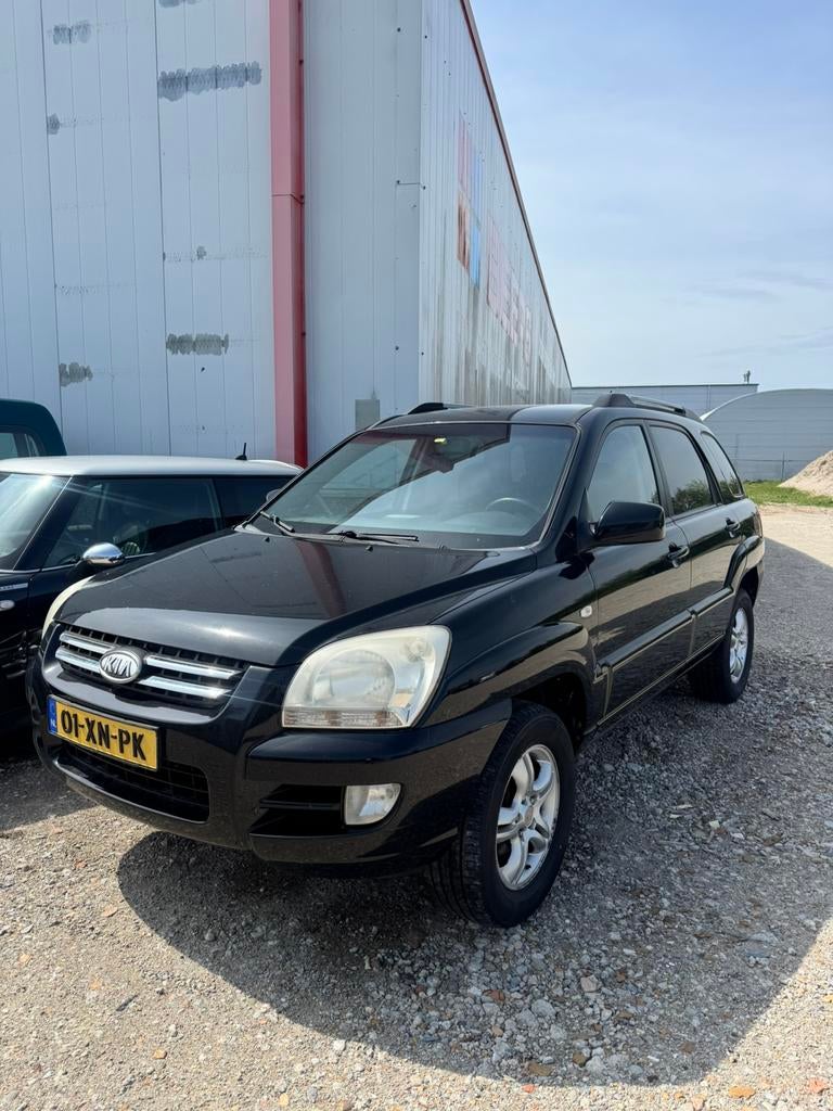Kia Sportage 2.0 2WD 2007 Zwart, Auto's, Kia, 1442 kg, Zwart, 4 cilinders, Stoelverwarming