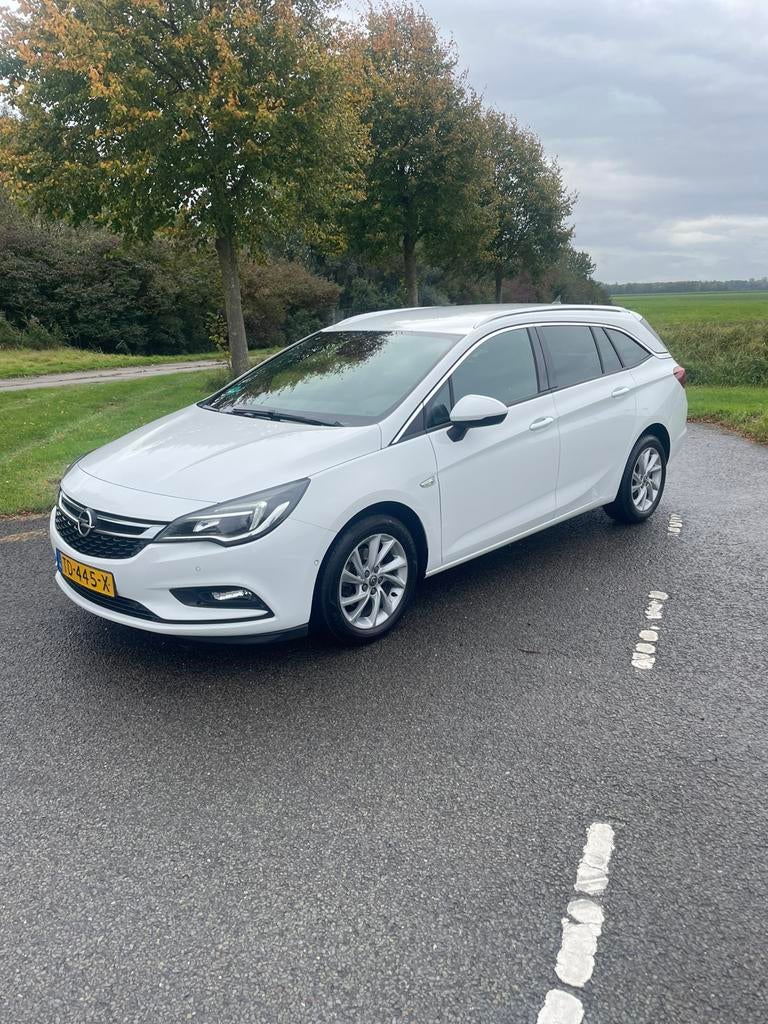 Opel Astra 1.4 Turbo 150pk Start/stop Aut 2018 Wit, Auto's, Leder en Stof, Wit, Origineel Nederlands, Stationwagon