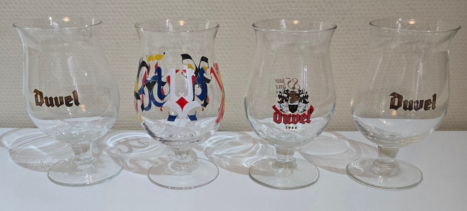 Mooie set van 4 Duvel glazen (2x collectors edition), Ophalen, Nieuw, Bierglas