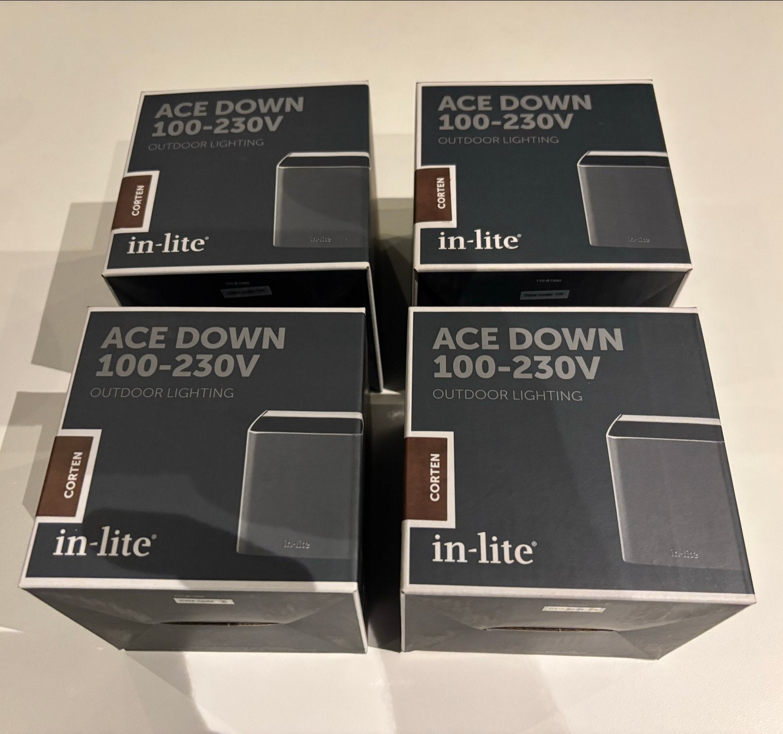 In-Lite Ace Down Corten 100-230V set 4 stuks - €337 korting, Tuin en Terras, Staal, Minder dan 50 watt, Wandlamp, Nieuw