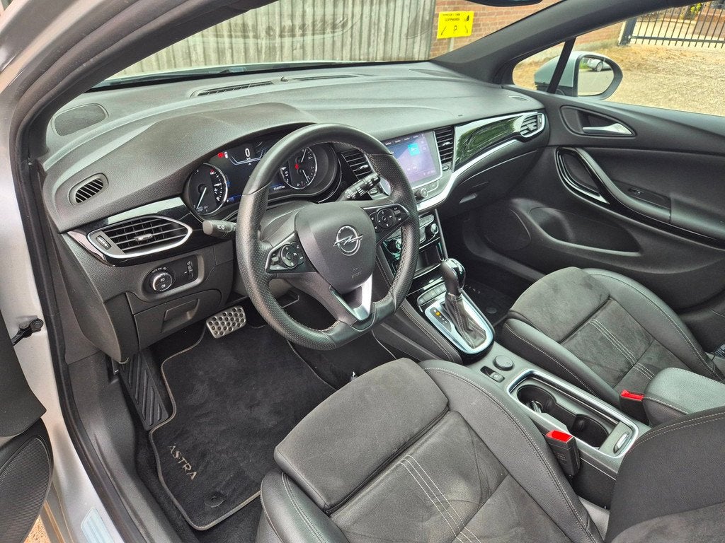 Opel Astra Sports Tourer 1.4 Ultimate Automaat, Trekhaak, Na, Auto's, Opel, Gebruikt, 146 pk, Grijs, 3 cilinders