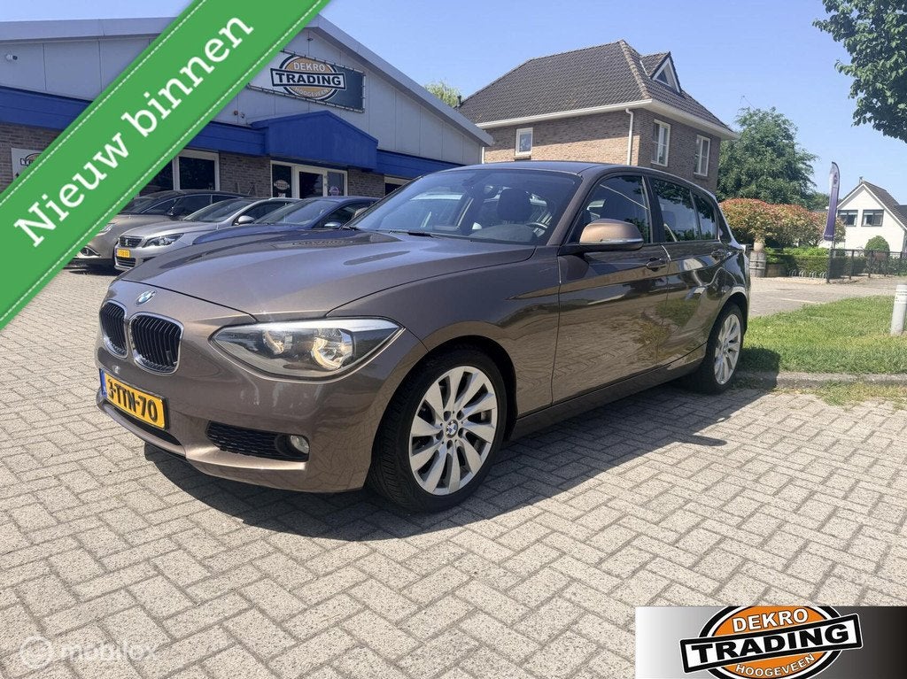 BMW 1-serie 116i Business Automaat, Auto's, Navigatiesysteem, Gebruikt, 4 cilinders, Bruin