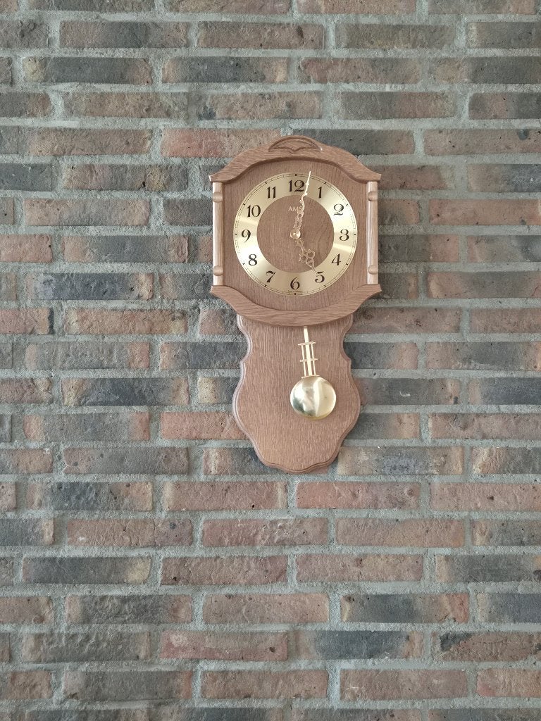 AMS eikenhouten slingerklok, Ophalen