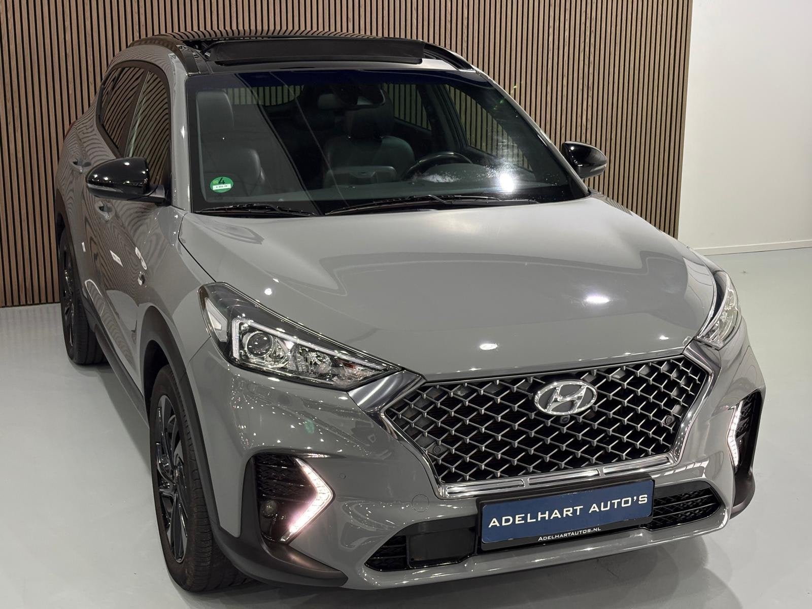 Hyundai Tucson 1.6 T-GDI N-Line Nardo Grey 177 PK automaat P, Auto's, Dealer onderhouden, 15 km/l, Gebruikt, 4 cilinders