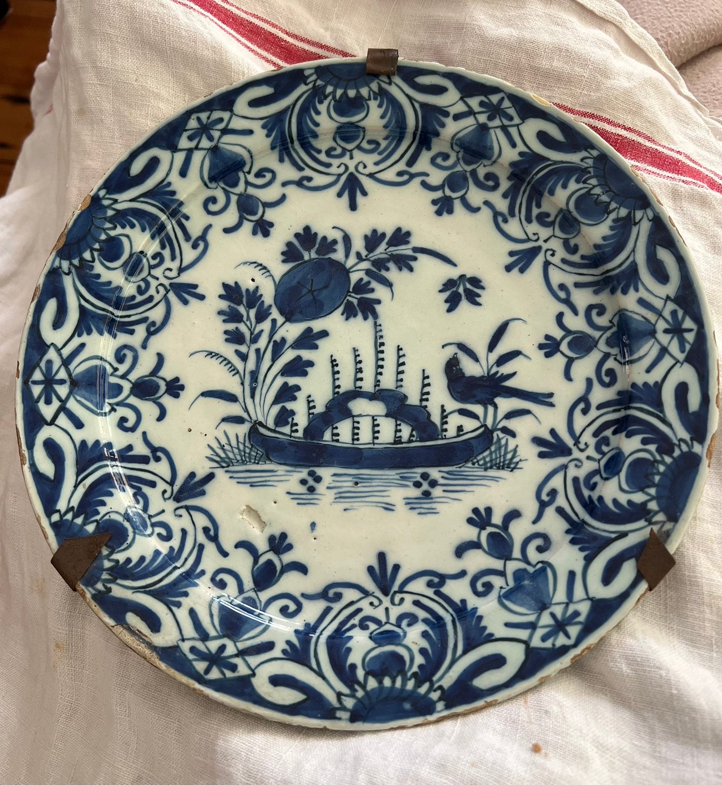 Blauw bord met boot en vogel, Ophalen