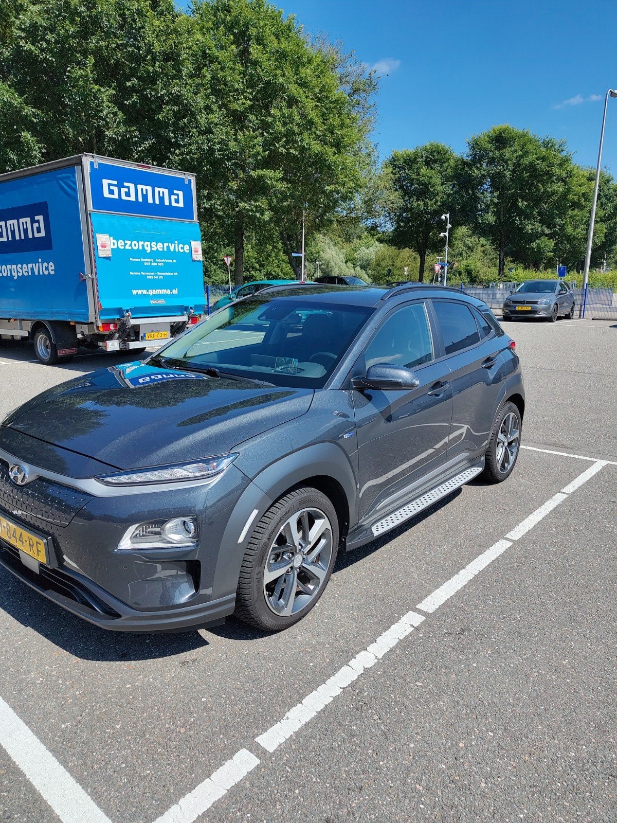 Hyundai Kona EV Premium - 64kwh 2WD Aut. 2020 Grijs, Auto's, Hyundai, 14 kWh, Lichtsensor, Origineel Nederlands, Elektrisch