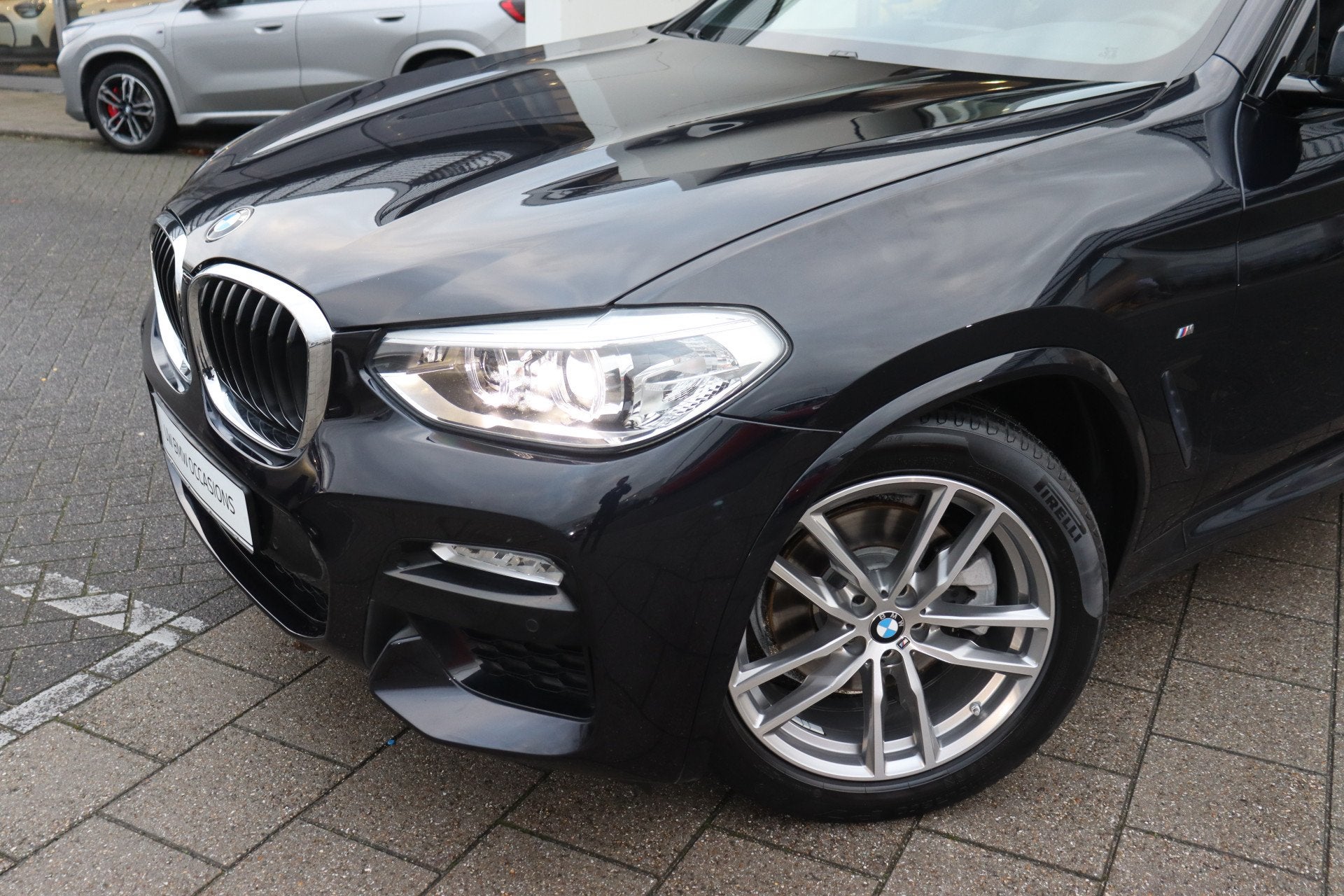BMW X3 xDrive20i High Executive M Sport Automaat / Sportstoe, Auto's, BMW, Gebruikt, 4 cilinders, Zwart, Bedrijf