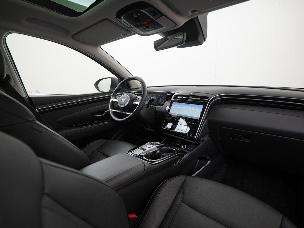 Hyundai Tucson 1.6 T-GDI PHEV Premium Sky 4WD | Panoramadak, Auto's, Hyundai, 14 kWh, Gebruikt, 4 cilinders, Wit