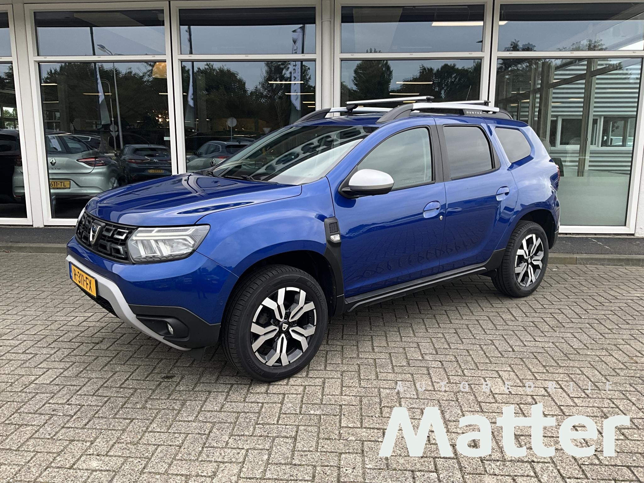 Dacia Duster 1.3 TCe Prestige Trekhaak | Camera, Auto's, Stof, Gebruikt, 4 cilinders, Blauw