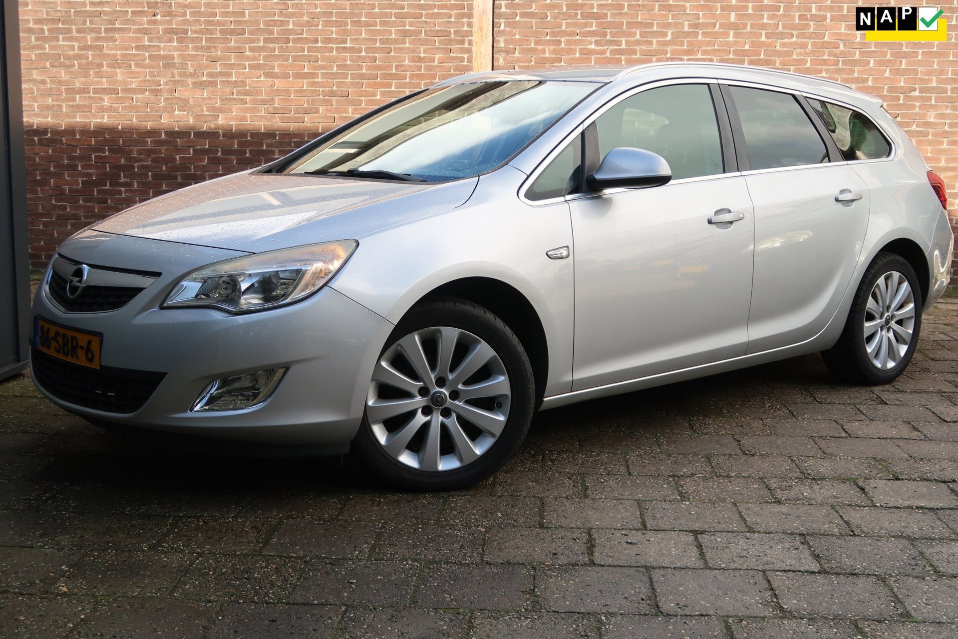 Opel Astra Sports Tourer 1.4 Turbo Cosmo *Rijklaarprijs *NAP, Voorwielaandrijving, Euro 5, Gebruikt, Zwart