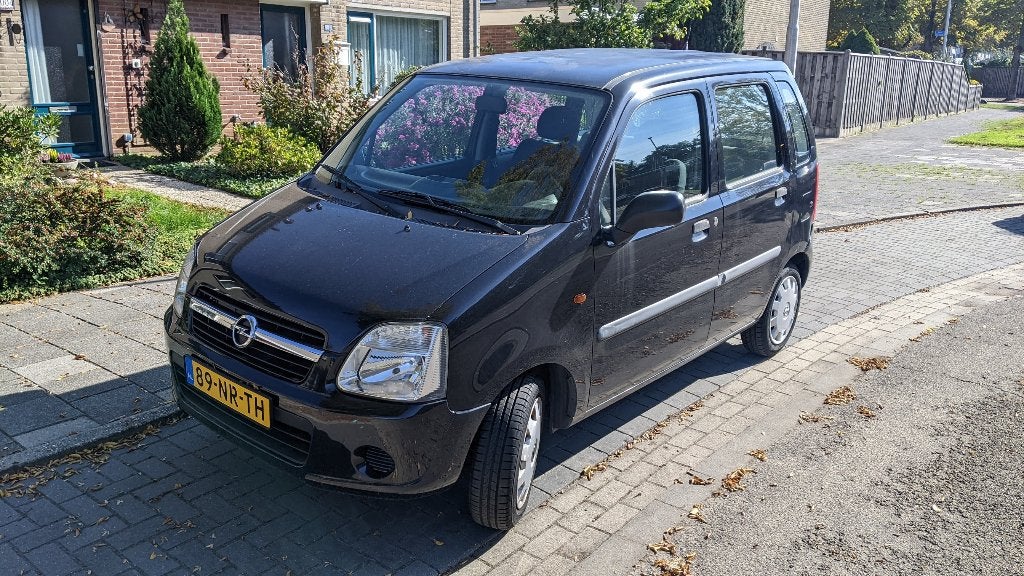 Opel Agila 1.2 I 16V 2004 Zwart 55.000km, Auto's, Voorwielaandrijving, Stof, Zwart, Origineel Nederlands