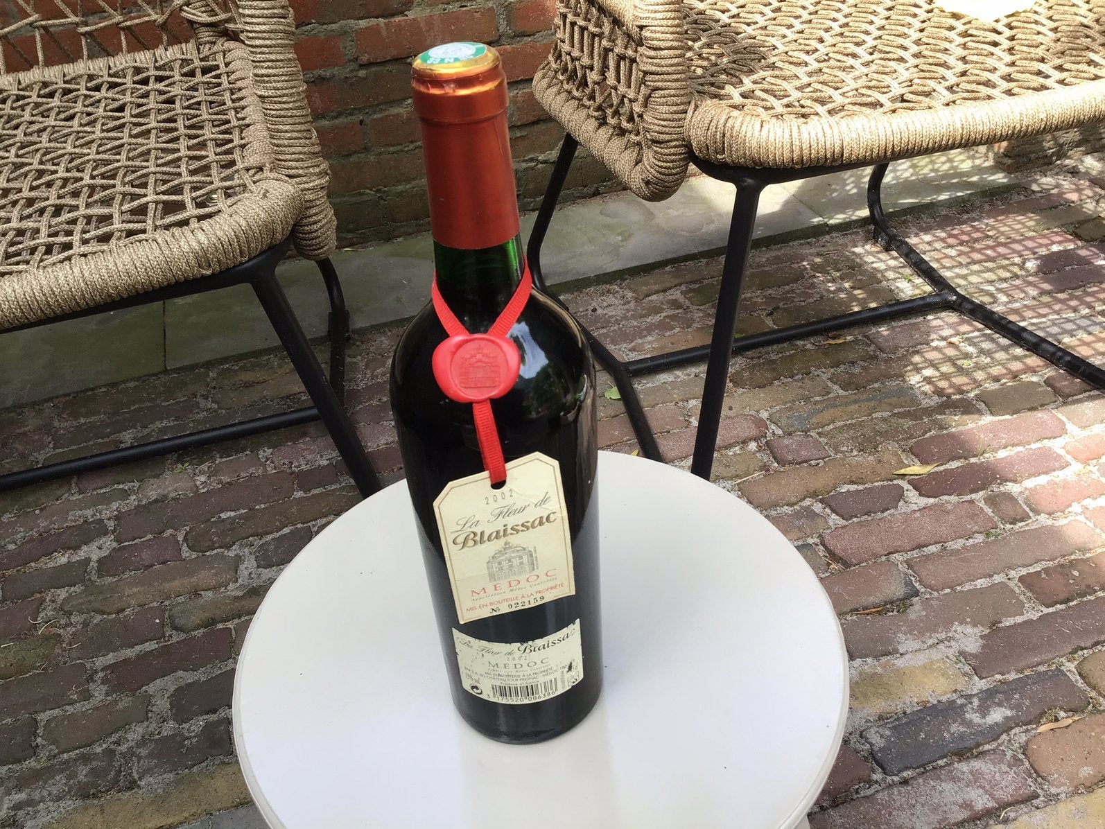 Fles wijn uit 2002, Ophalen, Zo goed als nieuw