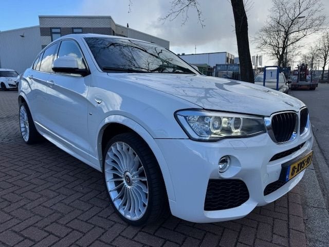BMW X4 xDrive20i High Executive M-Edition Automaat Airco/ECC, Gebruikt, 4 cilinders, Wit, Bedrijf