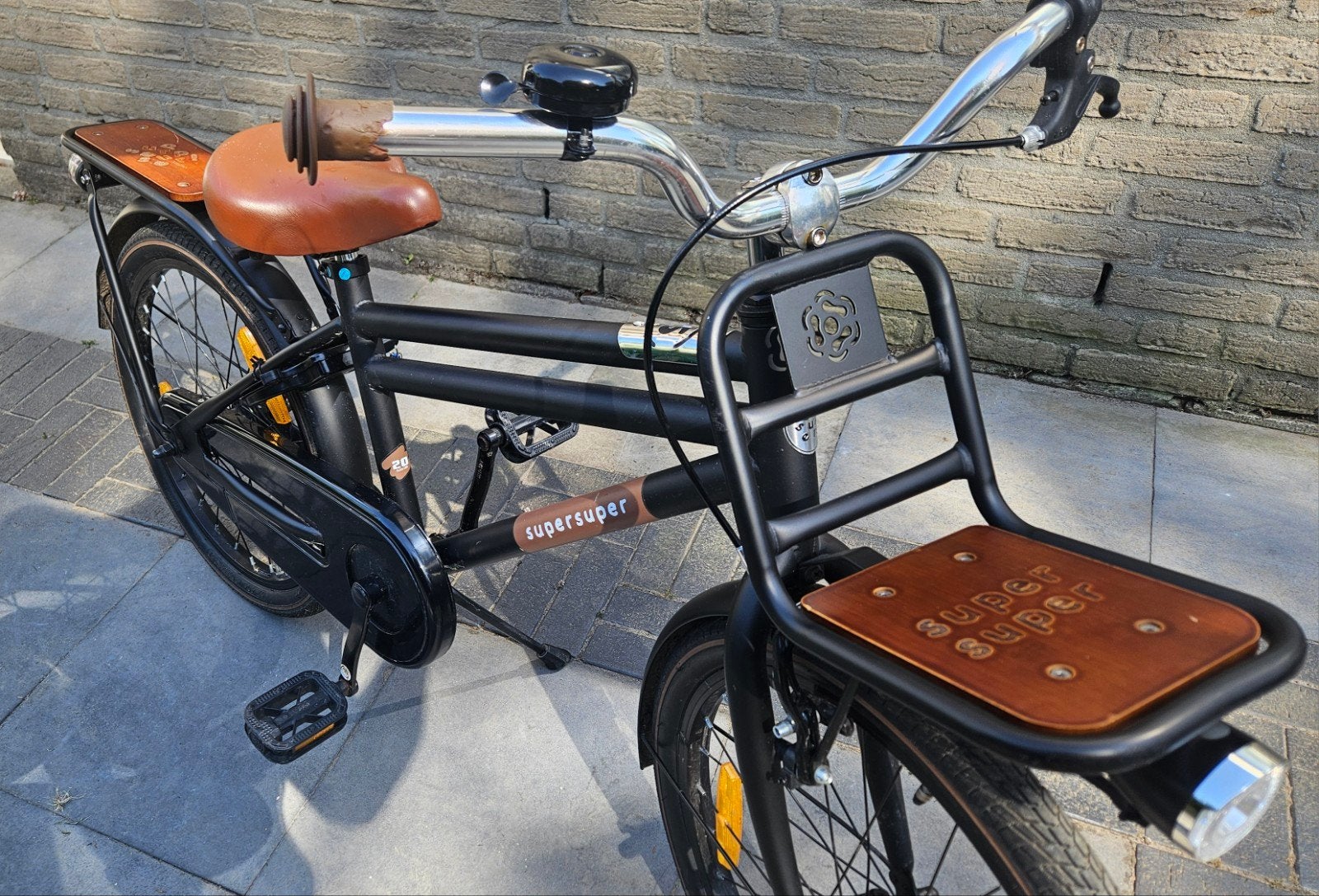 Zwarte SuperSuper Cooper 20 inch kinder transportfiets., 20 inch of meer, Velgrem, Zo goed als nieuw, Ophalen