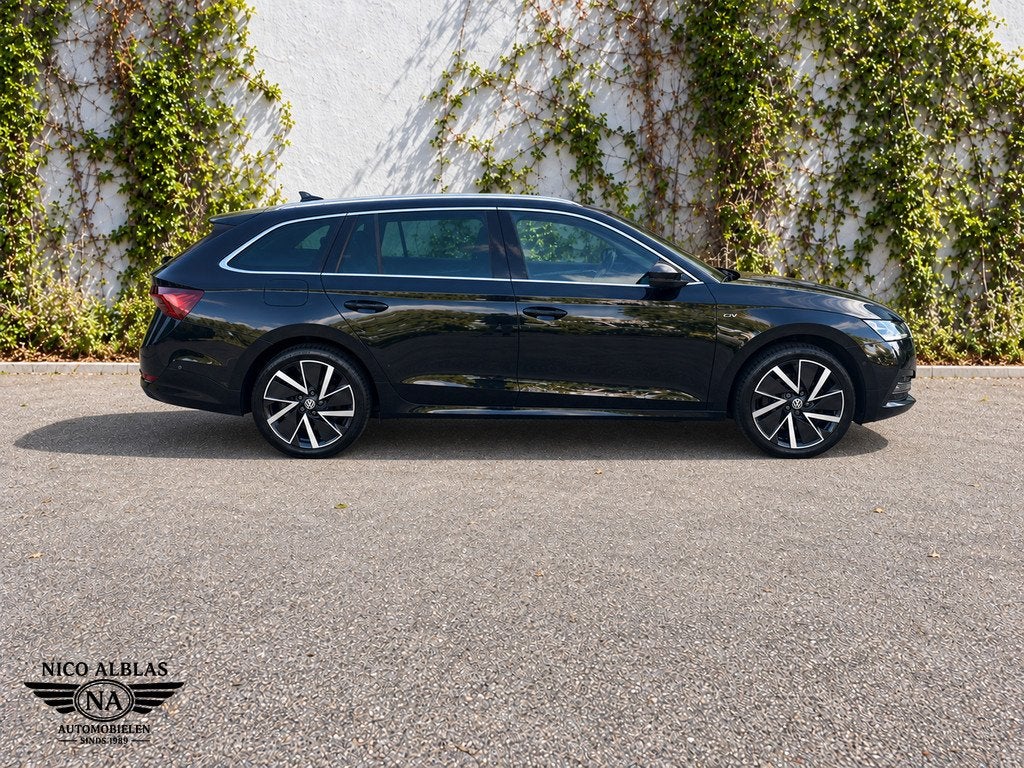 Skoda Octavia Combi 1.4 TSI iV PHEV Business Edition Plus, Auto's, Dealer onderhouden, Gebruikt, Zwart, Plug-in hybride