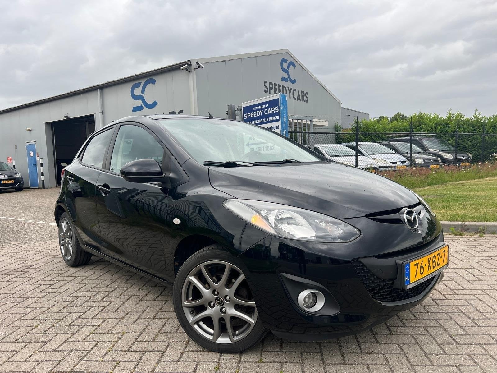 Mazda 2 1.3 BIFUEL Navigator GT 2012 LPG G3 Cruise Navi 5DRS, Voorwielaandrijving, Stof, Zwart, 4 cilinders