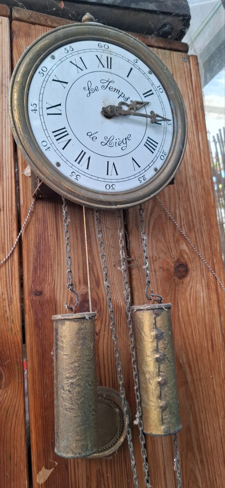 Antieke wandklok 'Le Temps de Liège' met kettingmechanisme, Ophalen