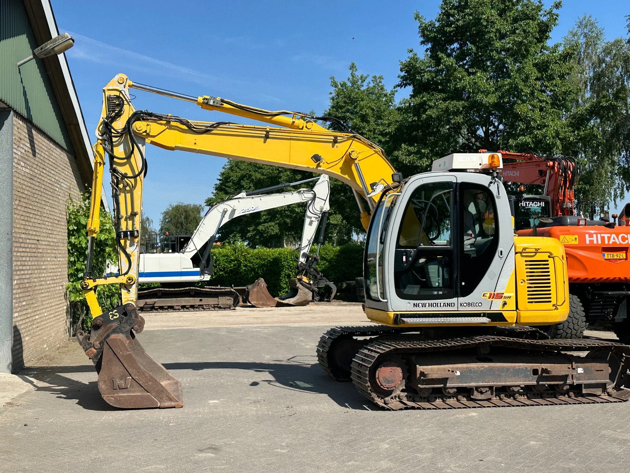 New Holland E115SR-1ES (bj 2005), Zakelijke goederen, Machines en Bouw | Kranen en Graafmachines, Graafmachine