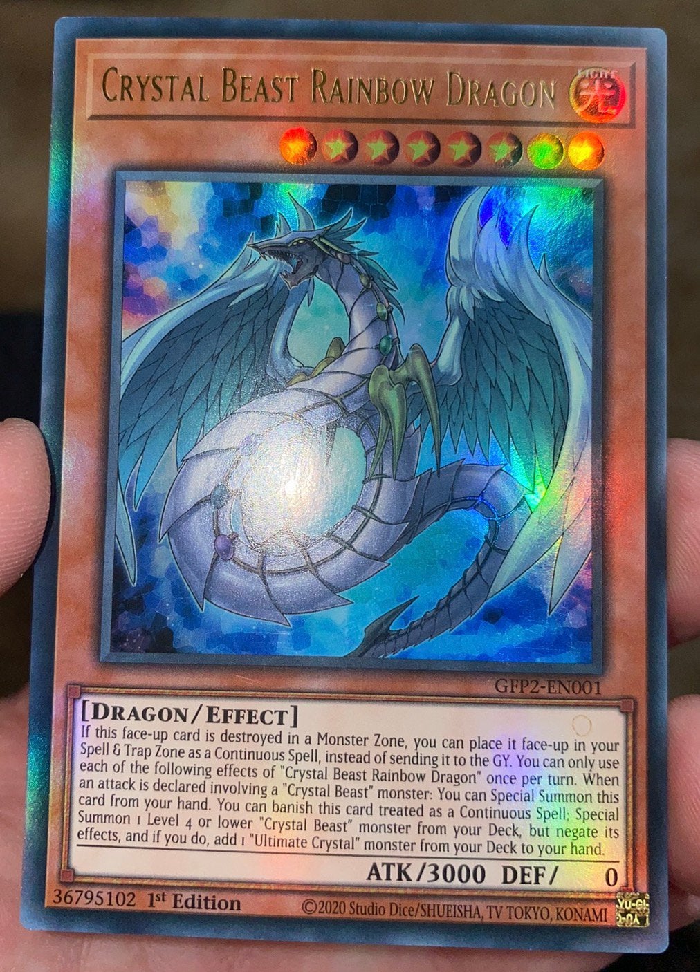 Yu-Gi-Oh! Crystal Beast Rainbow Dragon GFP2 1st Edition !, Ophalen of Verzenden, Zo goed als nieuw, Losse kaart, Foil
