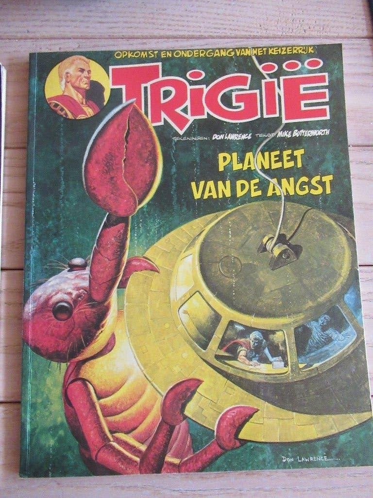 2 strips Trigie, Gelezen, Don Lawrence, Mike Butterworth, Europa, Ophalen of Verzenden