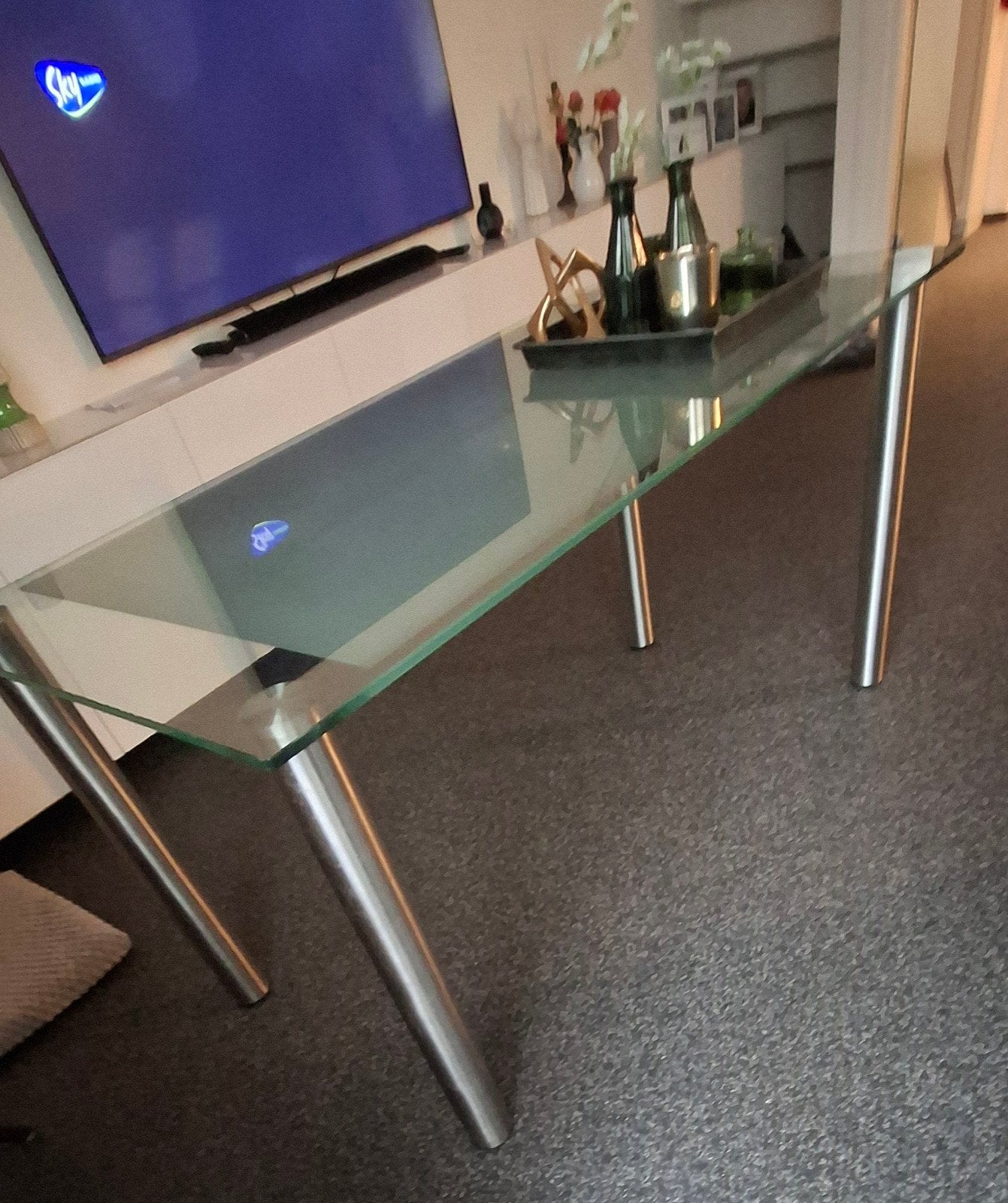 Glazen eettafel met metalen poten, Huis en Inrichting, Ophalen, Gebruikt, 100 tot 150 cm, 50 tot 100 cm