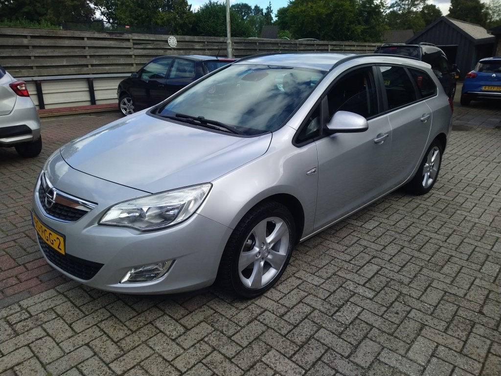 Opel Astra Sports Tourer 1.4 Turbo Edition (bj 2011), Auto's, Euro 5, Gebruikt, 4 cilinders, 1337 kg