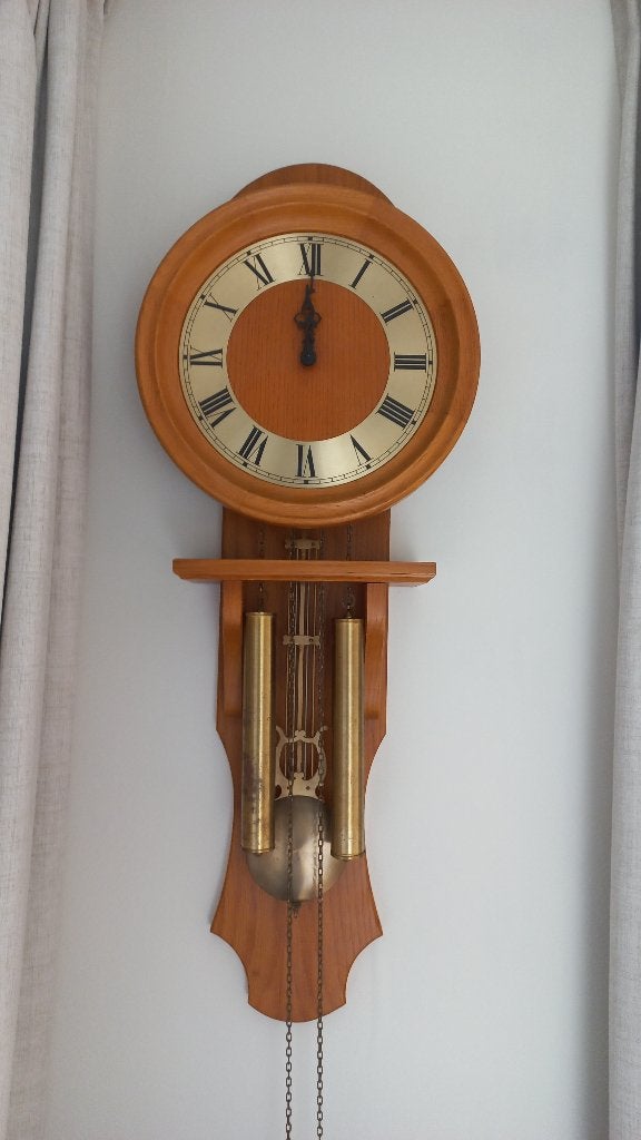 Slinger wandklok, Ophalen