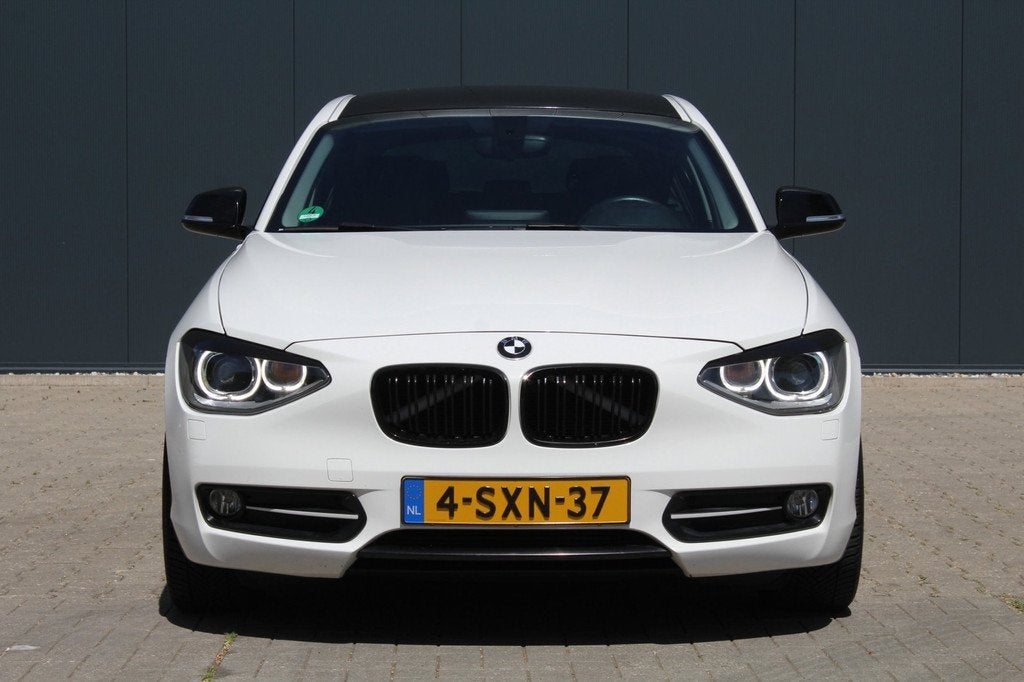 BMW 1-serie 116i High Executive | Automaat | Navigatie | Sto, Auto's, Gebruikt, 4 cilinders, Wit, 650 kg