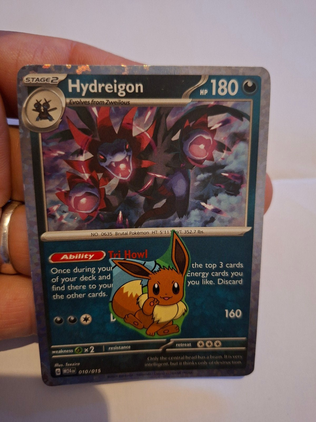 Pokémon Kaart Hydreigon met Eevee Sticker-Zo goed als nieuw, Ophalen of Verzenden, Zo goed als nieuw, Losse kaart