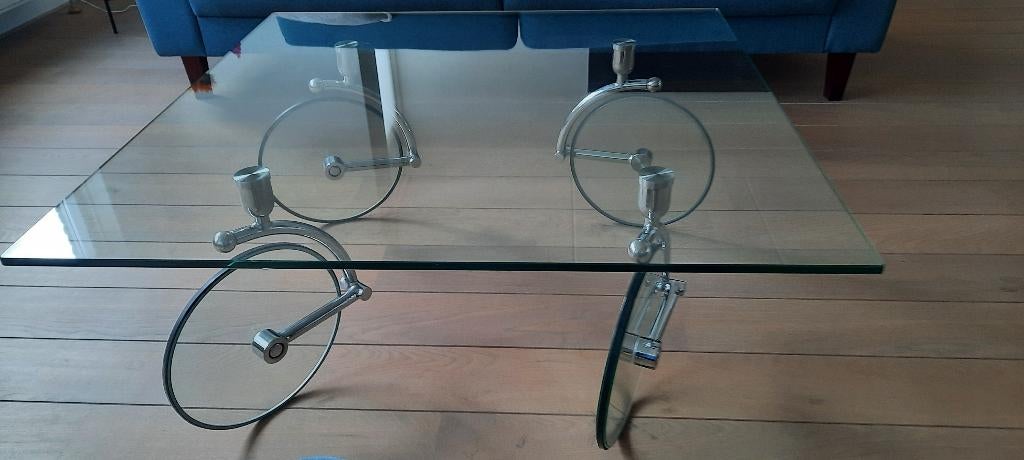 Mooie, aparte glazen salontafel ' Wheels' van Kare-design, Huis en Inrichting, Tafels | Salontafels, Ophalen, Gebruikt, 100 tot 150 cm