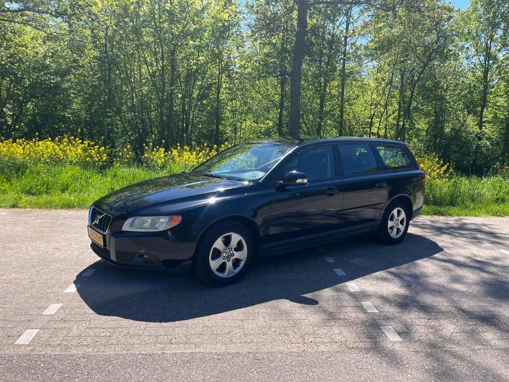Volvo V70 2.4 D 120KW Zwart, Auto's, Volvo, Voorwielaandrijving, 15 km/l, Zwart, Leder en Stof