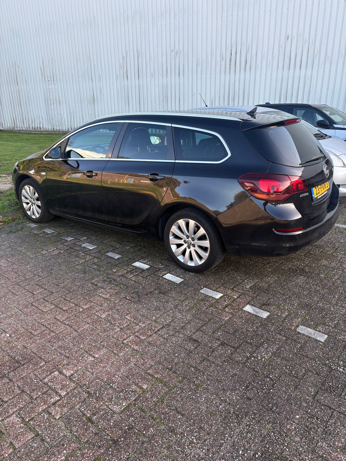 Opel Astra 1.4 74KW Sports Tourer 2011 Zwart, Auto's, Voorwielaandrijving, 4 cilinders, 100 pk, Zwart