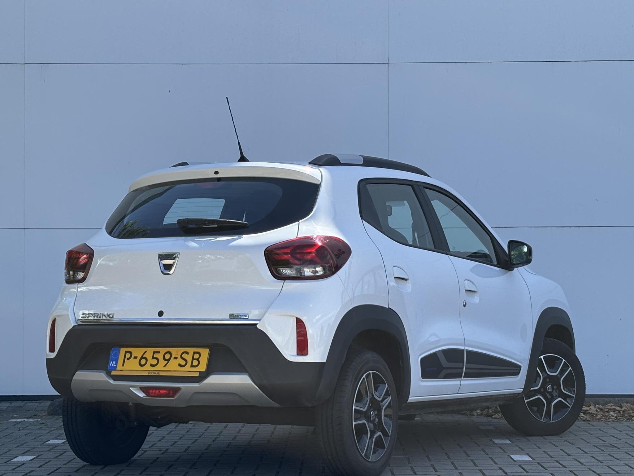 Dacia Spring Comfort 27 kWh | 1e Eigenaar | Airco |, Auto's, Dacia, Gebruikt, 38 min, Leder en Stof, Wit