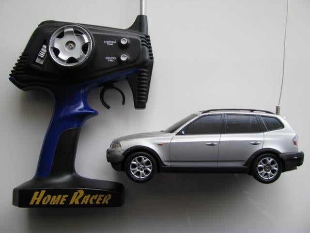 Bmw x3 op afstand bestuurbaar met lader en battery houder, Ophalen of Verzenden, Zo goed als nieuw, Afstandsbediening
