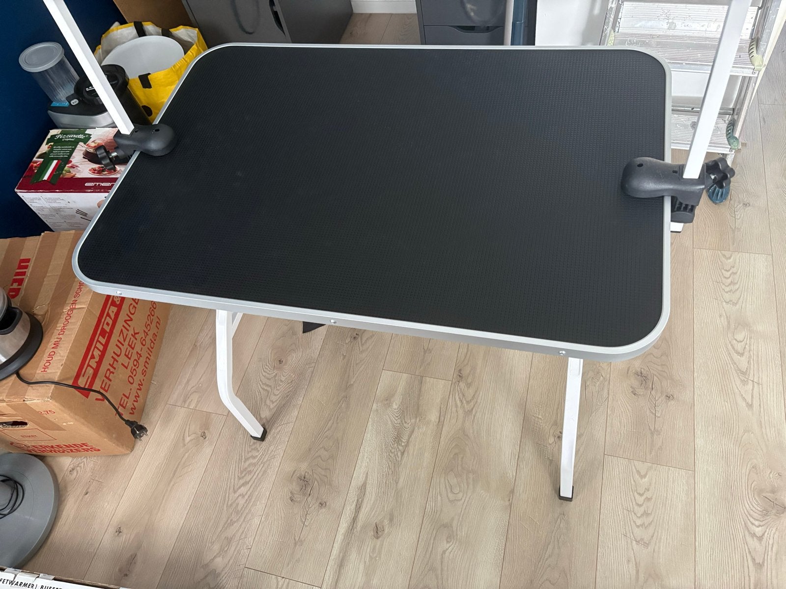 Trim tafel, Ophalen