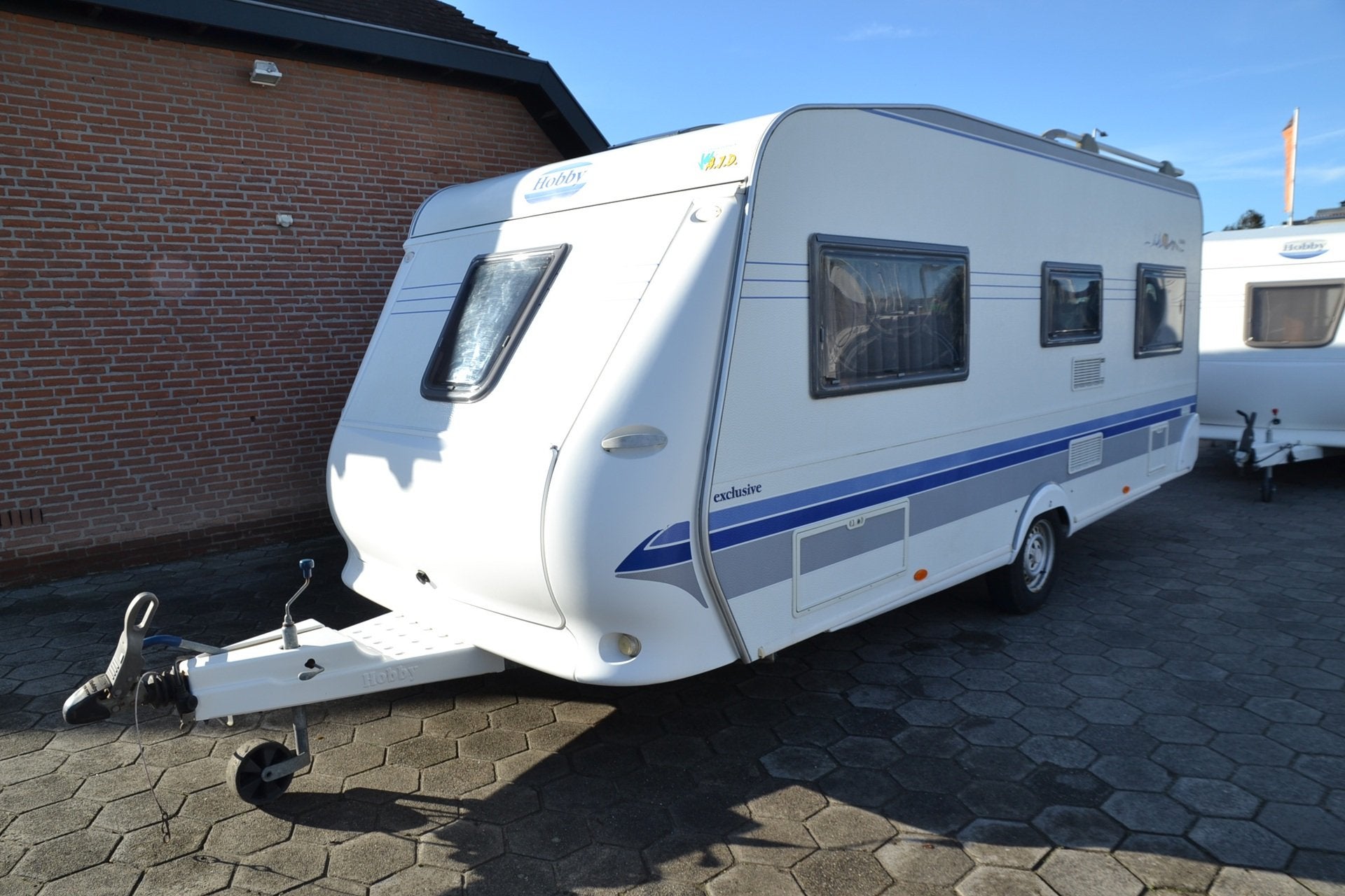 Hobby 495 B Exclusive - Frans bed - Wc+Douche - Voortent - G, Caravans en Kamperen, Vast bed, Schokbreker, Bedrijf, 4 tot 5 meter