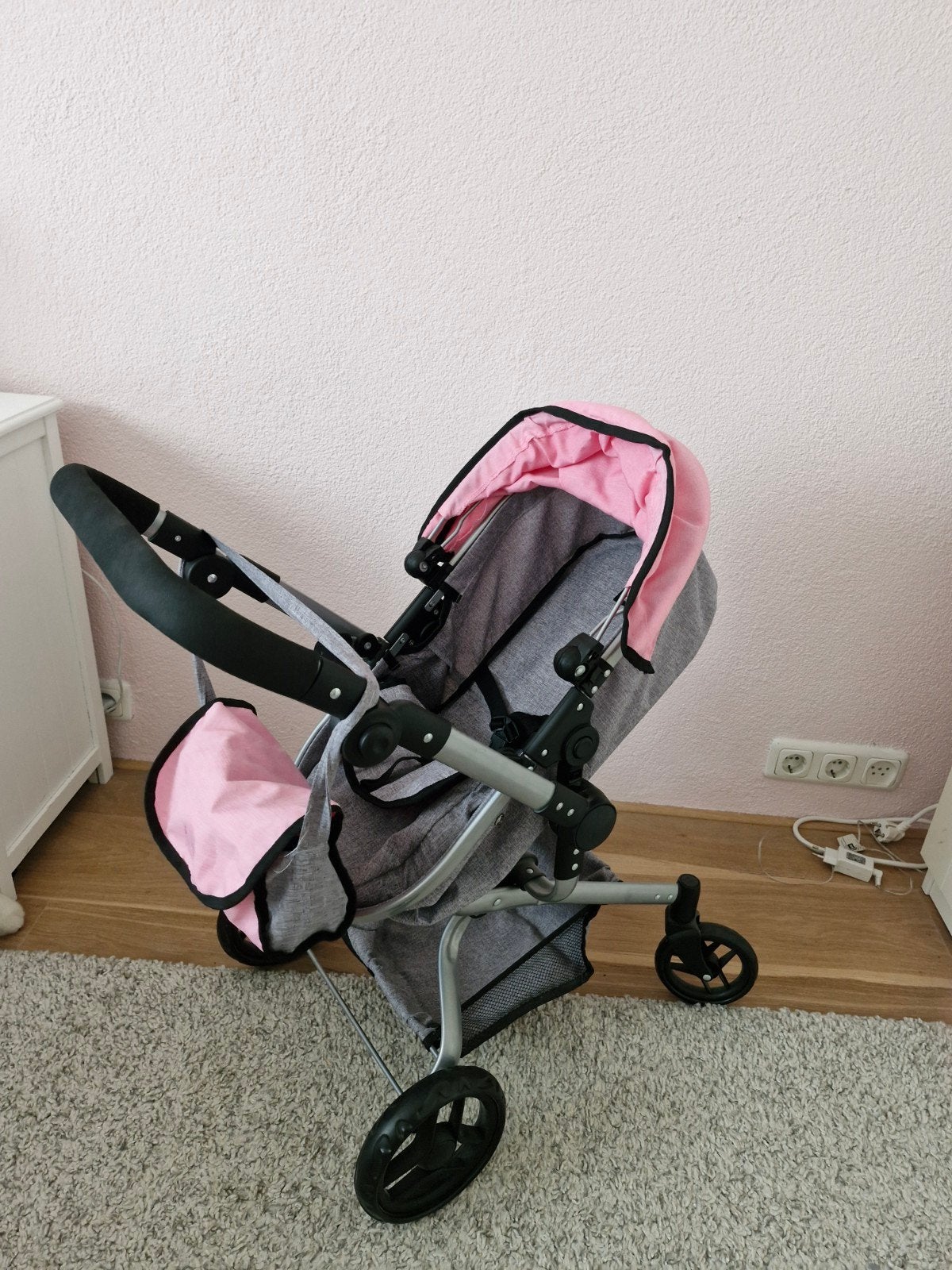Roze poppenwagen met verstelbare duwstang, Ophalen