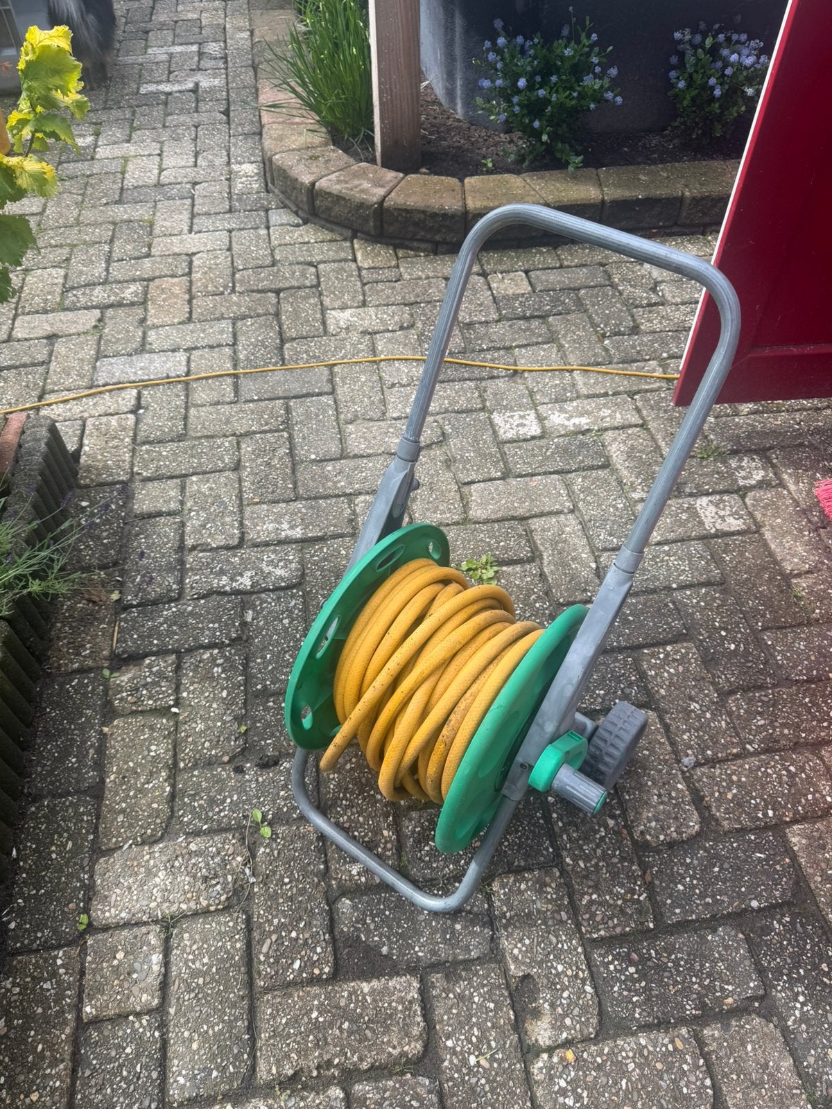 Tuinslang haspel, Ophalen, Gebruikt, Tuinslang