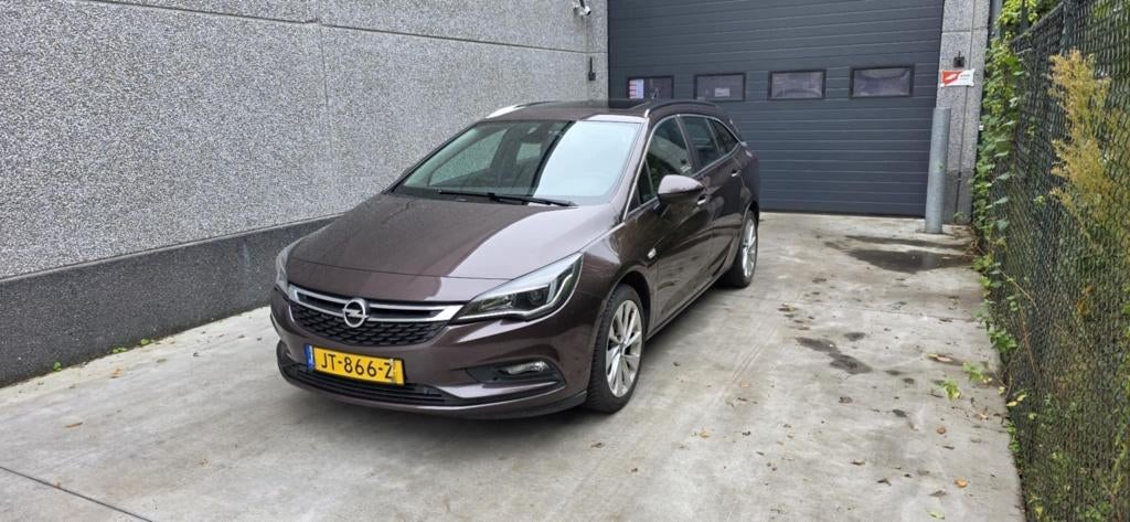 Opel Astra 1.0 Turbo 77KW Sports Tourer 2016 Bruin, Auto's, Voorwielaandrijving, Stof, 1178 kg, Bruin