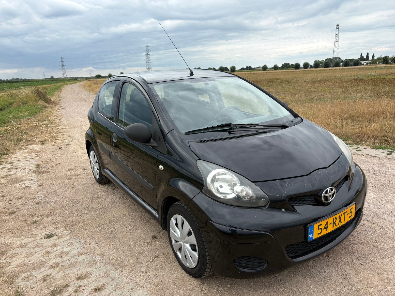 Toyota Aygo 1.0 12V Vvt-i 5DRS 2011 Zwart, Auto's, Toyota, Voorwielaandrijving, 4 stoelen, Origineel Nederlands, Handgeschakeld
