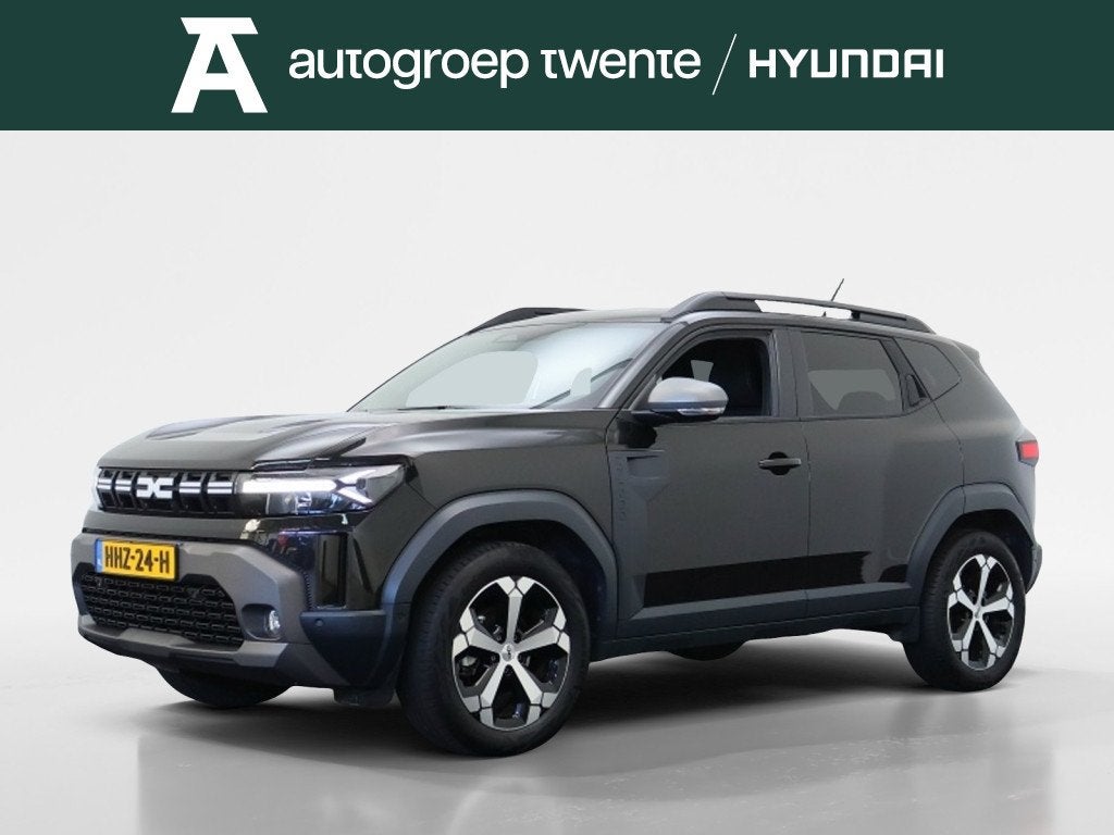 Dacia Duster 1.6 Hybrid 140 Journey | Trekhaak | Navigatie |, Auto's, Stof, Gebruikt, 4 cilinders, Zwart