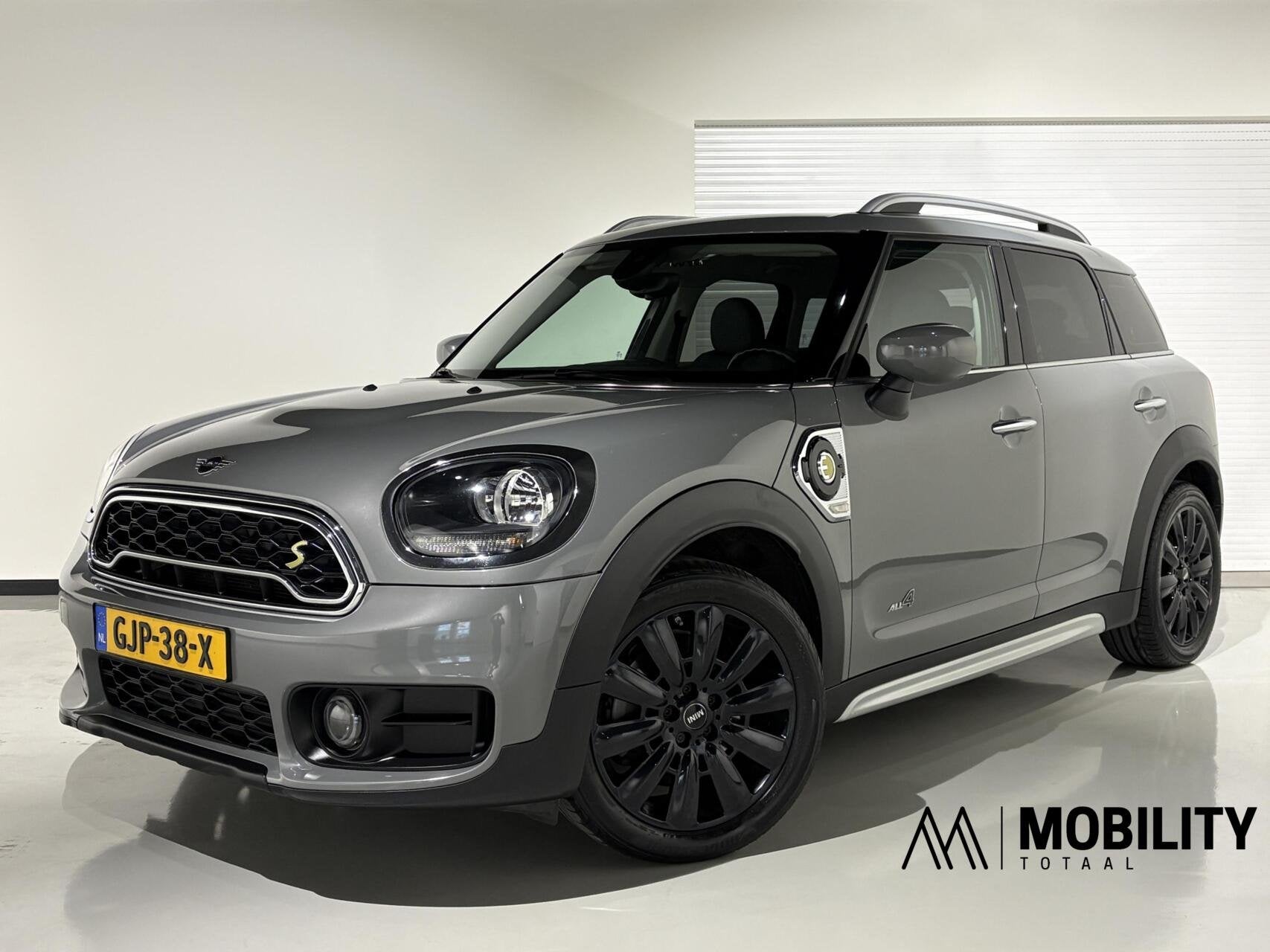 Mini Countryman 1.5 Cooper S E ALL4|Navi|Sportstoelen|Cruise, Auto's, Automaat, Dealer onderhouden, Gebruikt, Leder en Stof
