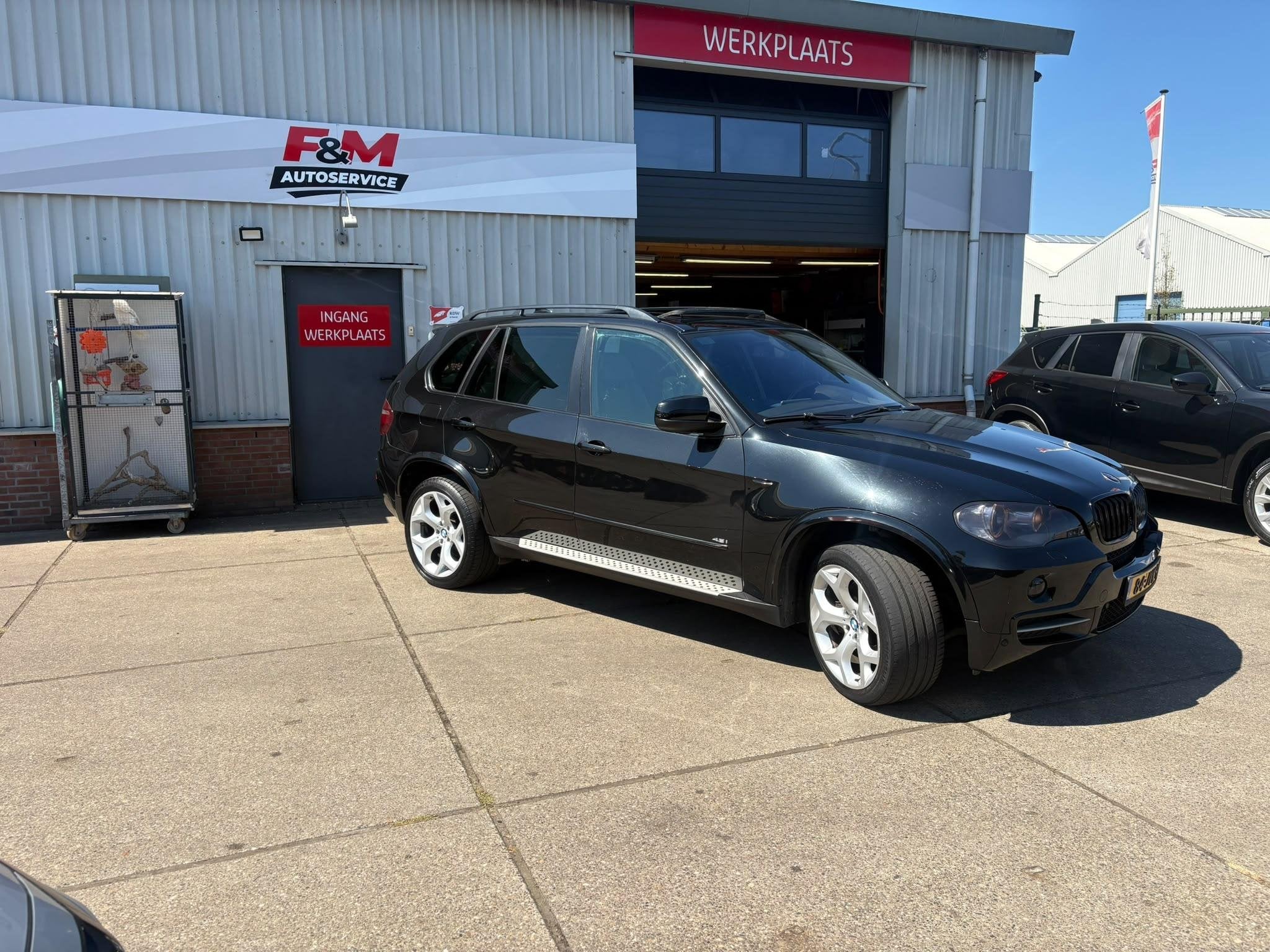 BMW X5 xDrive48i High Executive 7p, Clima, cruise, HUD, stoe, Automaat, Gebruikt, 138 €/maand, Zwart