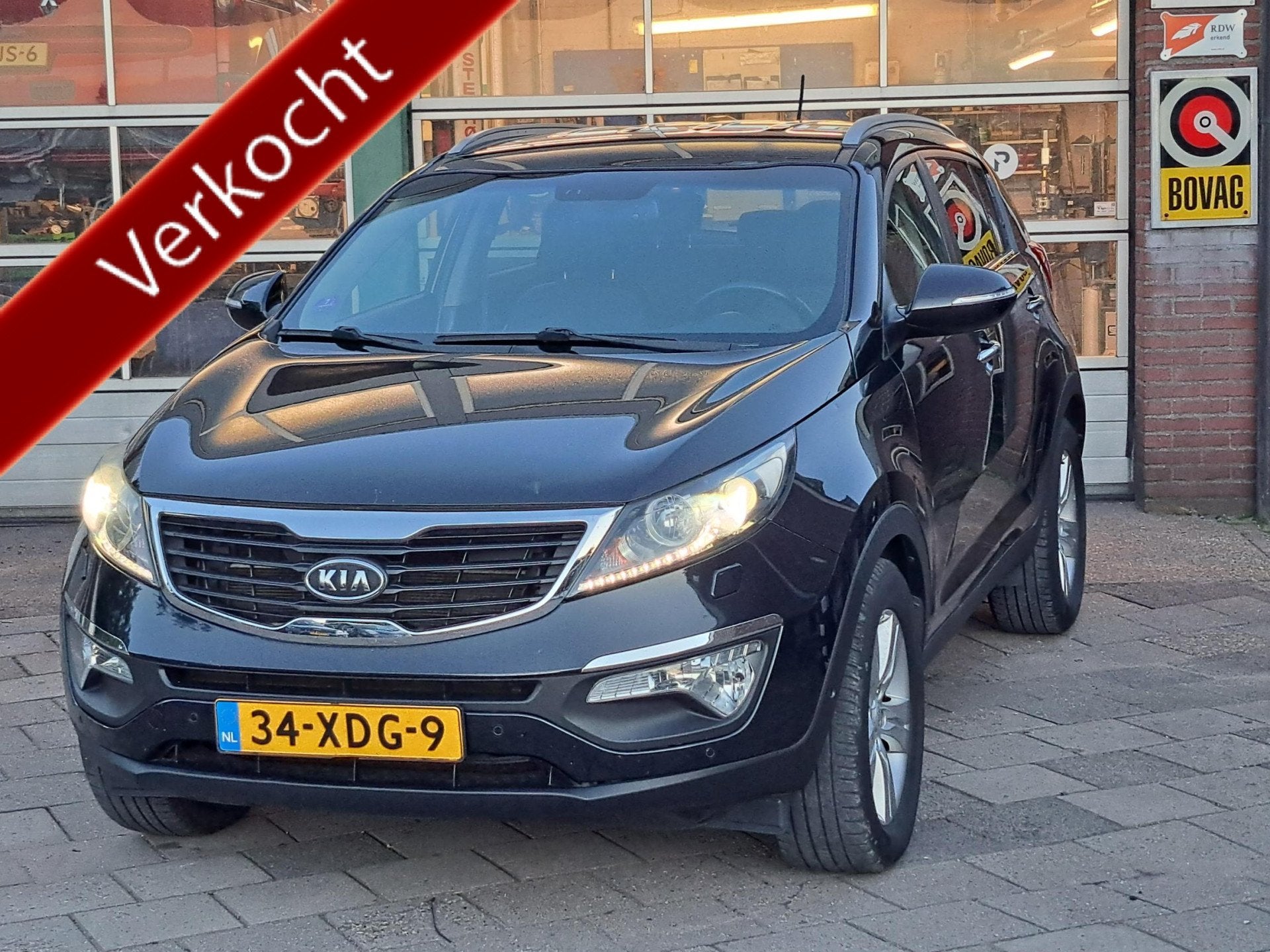 Kia Sportage 1.6 GDI Super Pack/Trekhaak/Leer/Navi, Auto's, 135 pk, 4 cilinders, Zwart, 1200 kg