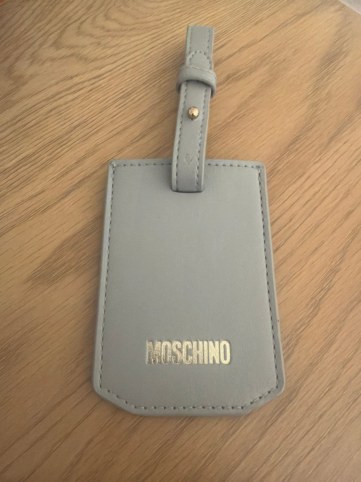 Moschino bagagelabel - Nieuw, Ophalen, Nieuw, Grijs